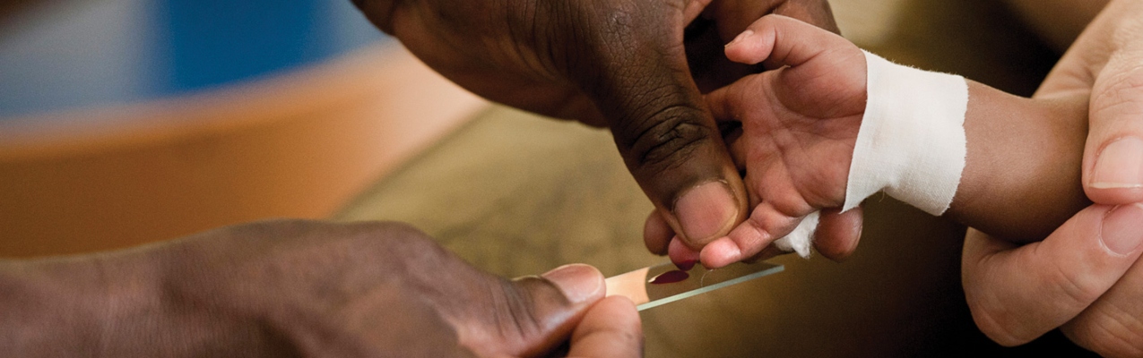 man taking a blood sample from a child