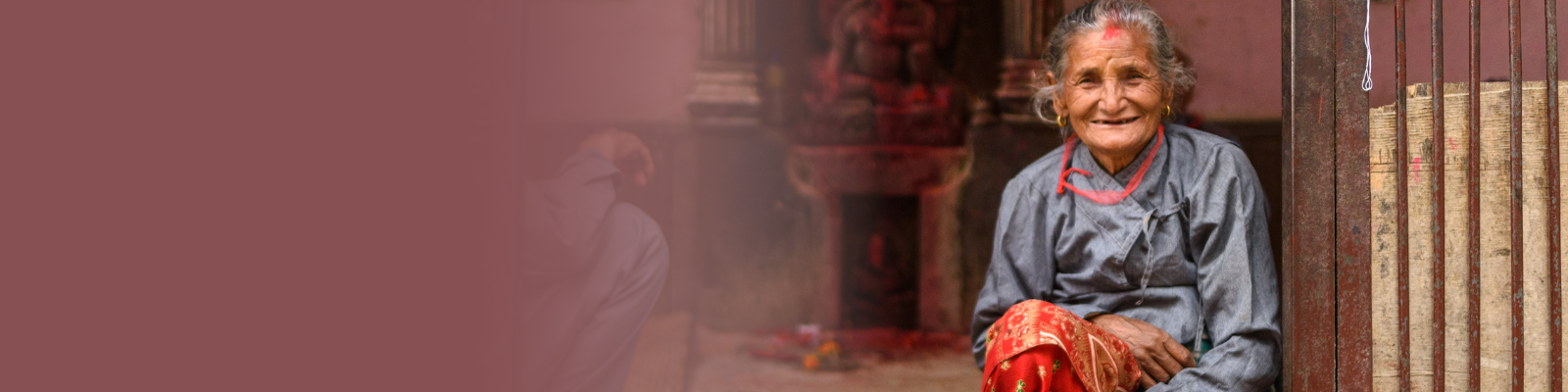 man and woman sitting in a home in Nepal