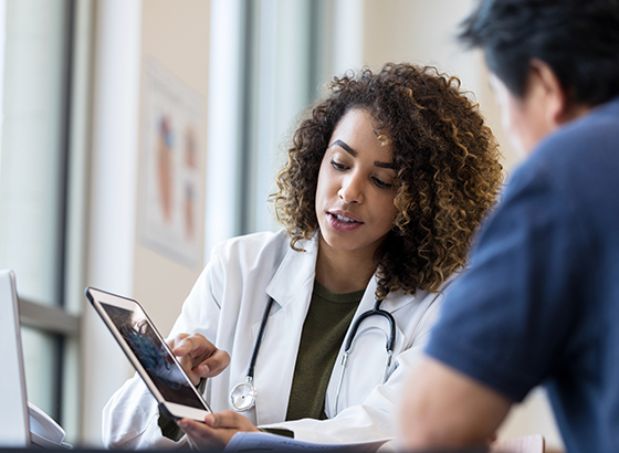 doctor helping patient