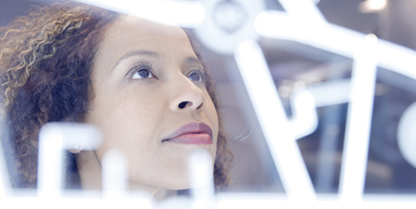 Woman scientist looking at computer data