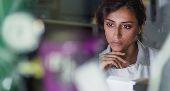 Woman scientist looking at computer