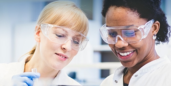 two female scientists talking