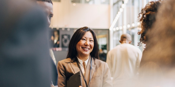 woman at conference smiling